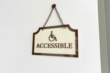 Handicapped sign on the entrance to the restroom.