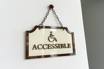 Handicapped sign on the entrance to the restroom.