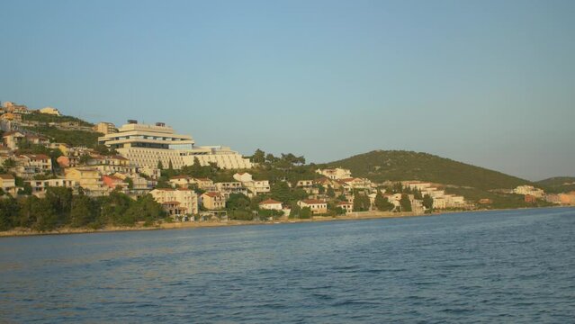 Boat trip in the bay of Neum on the Adriatic Sea with its colorful houses, in Bosnia