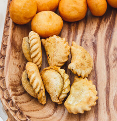 Fried doughnuts on a wooden tray
