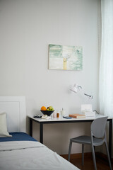 Fresh fruits, books and medicine on desk in nursing home bedroom