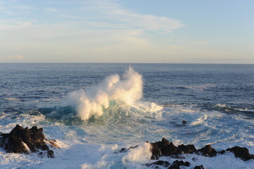 Big waves crashing and breaking on the rocks on the coast of Atlantic Ocean in Madeira Island, Portugal