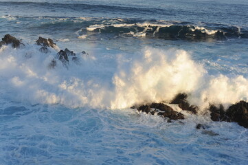 Big waves crashing and breaking on the rocks on the coast of Atlantic Ocean in Madeira Island, Portugal