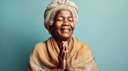 An afro senior woman conveys her faith with a peaceful smile and hands folded in prayer. Generative AI