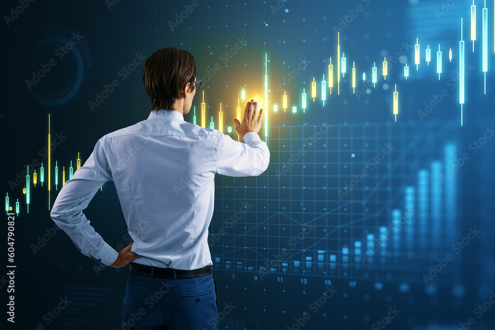 Poster fintech and market forecasting concept with rear view of businessman in suit working with digital fi