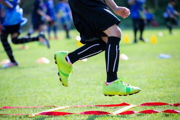 Athlete practicing running football sport on field equipment