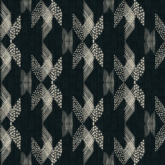 Seamless abstract textured geometric pattern. Beige pattern on a dark gray background. - 604792689