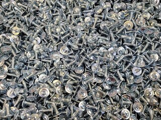 Self-tapping screws with a washer, used when working with metal products