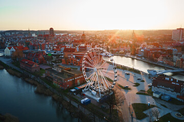 Fototapeta na wymiar Aerial view of ferris wheel attraction in Gdansk city, Poland. Panoramic view of touristic place in european city