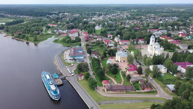 Aerial panoramic view of Russian town of Myshkin on banks of Volga River on summer day overlooking Assumption Cathedral and Nikolskaya church, Yaroslavl Oblast
