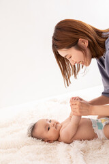 Obraz na płótnie Canvas スキンシップをとる赤ちゃんとママ　baby