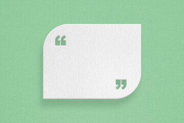 grunge blank white paper cut quote background with quotation marks on grunge green paper useful for...