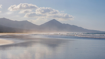 Cofete beach with beautiful water reflections on Fuerteventura, Spain - Canary Islands