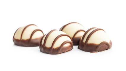 Sweet chocolate pralines.  Tasty chocolate truffles isolated on white background.