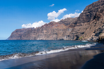 Fototapeta na wymiar Colorful sight of the cliffs by the ocean, Los Gigantes - Acantilados de Los Gigantes, Spain, Tenerife island, Canary islands