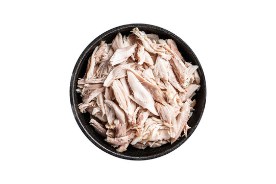 Sliced Pieces of chicken meat in a skillet, pulled chicken.  Isolated, transparent background.