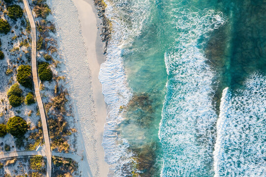 Spain, Balearic Islands, Formentera,Drone view of boardwalk stretching along sandy beach