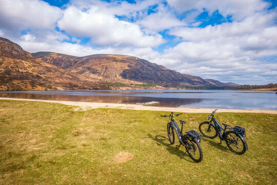 UK, Scotland, Two bicycles left on shore of Loch Affric