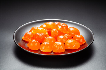 salted egg yolk in a black plate
