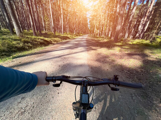 Obraz na płótnie Canvas POV bike handlebar closeup. Concept of riding a bicycle outdoors