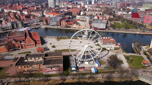 Aerial view of Gdansk city landscape with ferris wheel attraction in Poland. Historical center in old town in european city. Panoramic view of modern european city
