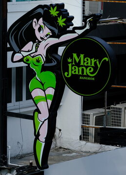 A sexy female character neon sign indicates a  cannabis dispensary on May 19, 2023 in Thai capital Bangkok