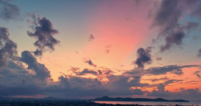 aerial view exotic colorful sky in bright sunrise above Chalong bay,.Scene of colorful romantic sky of sunrise.Gradient color Sky texture..amazing sky of bright sunrise in nature and travel concept