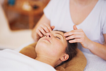 Fototapeta na wymiar Woman having japan style face massage in salon
