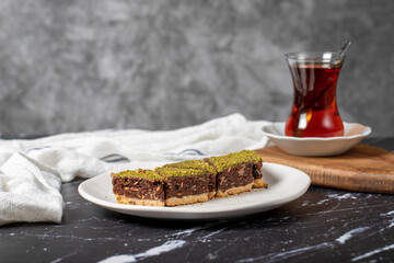 Pistachio and chocolate cookies. Delicious cookies on dark background