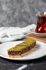 Pistachio and chocolate cookies. Delicious cookies on dark background. Close up