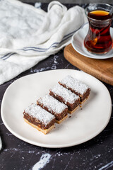 Coconut and chocolate cookies. Delicious cookies on dark background