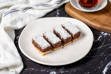 Coconut and chocolate cookies. Delicious cookies on dark background