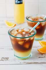 Trendy summer seasonal refreshing drink Bumble coffee on white background. Cold coffee recipe.