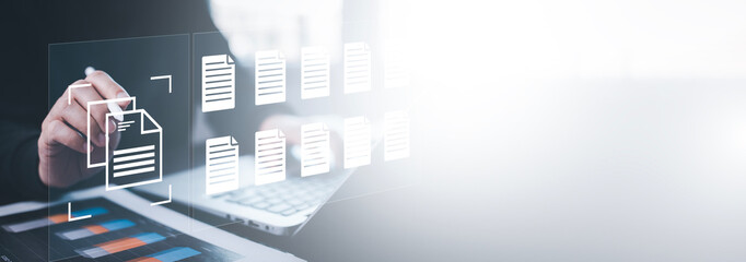 Businesswoman working on laptop with virtual screen. Online documentation database, IT consultant being set up Virtual Document Management System with a laptop, Software for archiving corporate files.