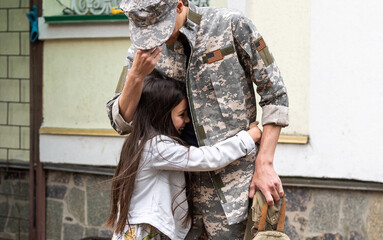 Soldier reunited with his daughter.