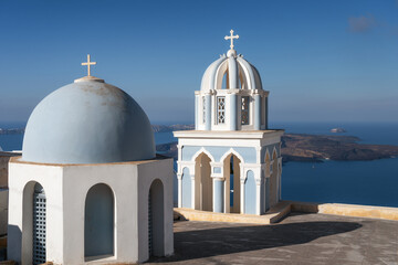 Paradise found in Santorini! This iconic image showcases the island's stunning blue domes, white houses, rugged caldera, and endless sea.