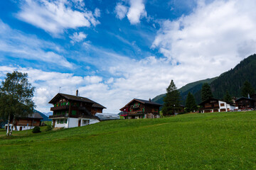 Ancient wooden traditional Swiss granaries and chalets on stone piles in an old abandoned village in Switzerland in mountains
