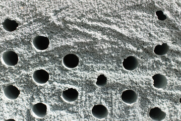 porous poriferous material for air ventilation with holes
