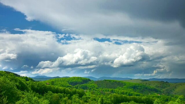 Nature picturesque landscape  cumulus clouds rolling over mountains and hills time-lapse