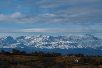 Winter snow covered mountain peaks.