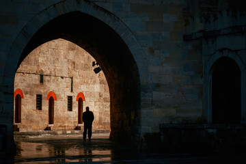 The man walking from the dark path to the light. 25 April 2023.