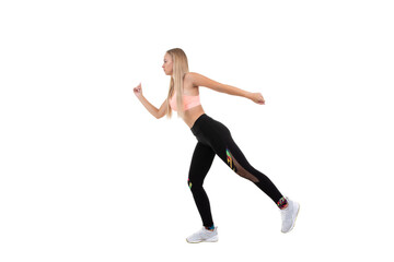 Fototapeta na wymiar A sporty woman in a pink top, dark leggings and sneakers does exercises on a white background. Isolated...