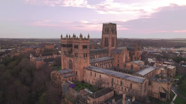 Drone descends tracking centre tower of Durham Cathedral on a winter morning 