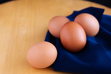 Close up of fresh chicken eggs on the table.