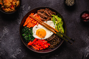 Traditional Korean dish Bibimbap: rice with vegetables beef and egg.