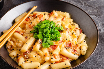 Spicy Rice Cake with Cheese and Bacon or Cream Teokbokki, Tteokbokki.