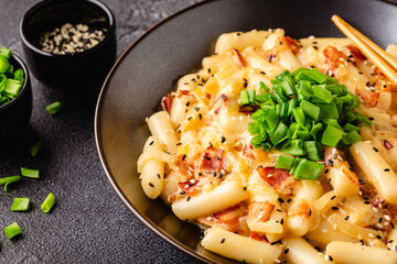 Spicy Rice Cake with Cheese and Bacon or Cream Teokbokki, Tteokbokki.