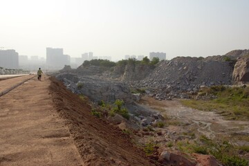 From nature to ruin.  Beautiful hills are grinded into dust in Hyderabad, Telangana, India. Photo: May 22nd 2023