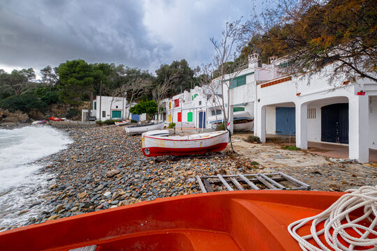 Fishermen's shacks in Cala S'Alguer on the coast of the Costa Brava in the province of Girona in Spain
