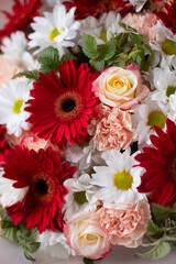 Bouquet of gerbera flowers. Red beautiful bouquet of mixed flowers. Flower shop. Fresh bouquet. Master class and floristry courses. Flower delivery.